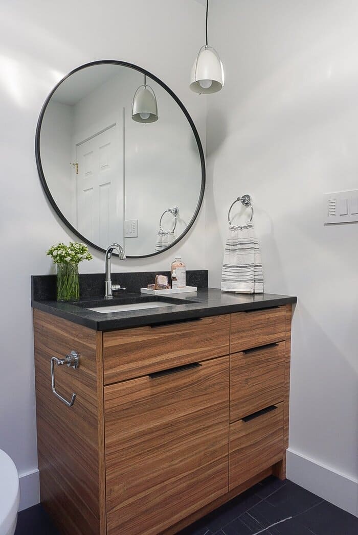 Niagara bathroom with custom wooden vanity and black quartz countertops
