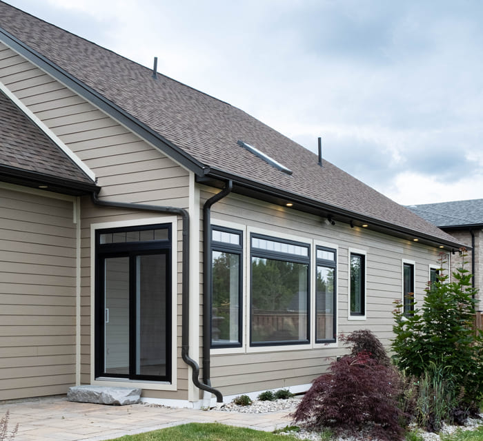Niagara home addition with taupe siding