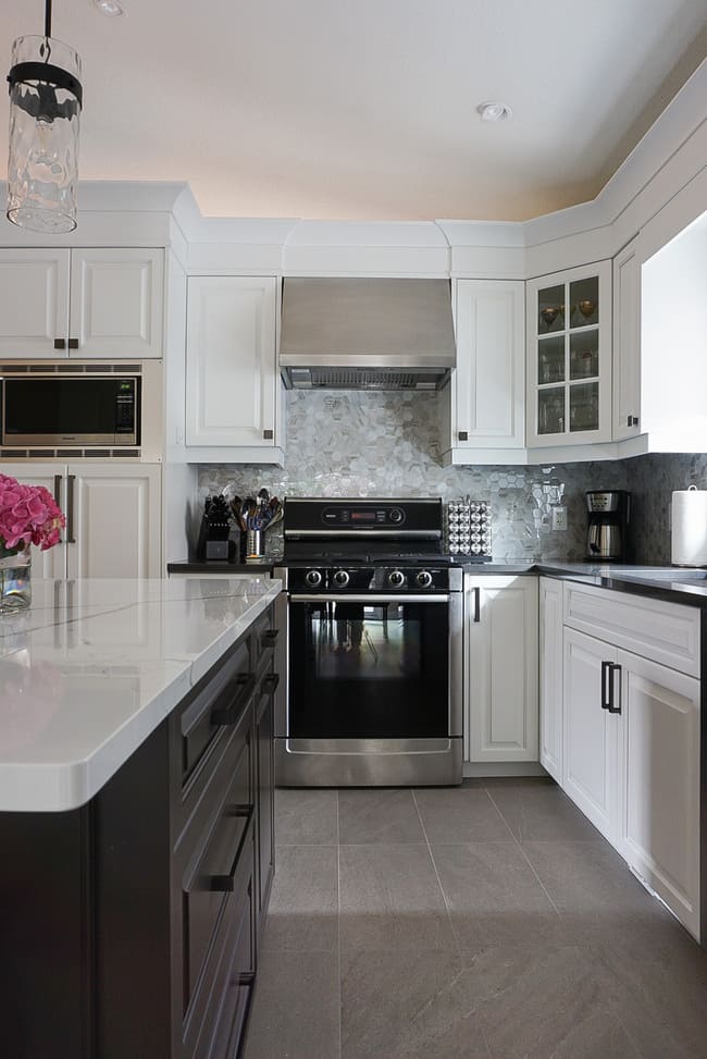 Niagara kitchen with white and grey cabinetry and stove