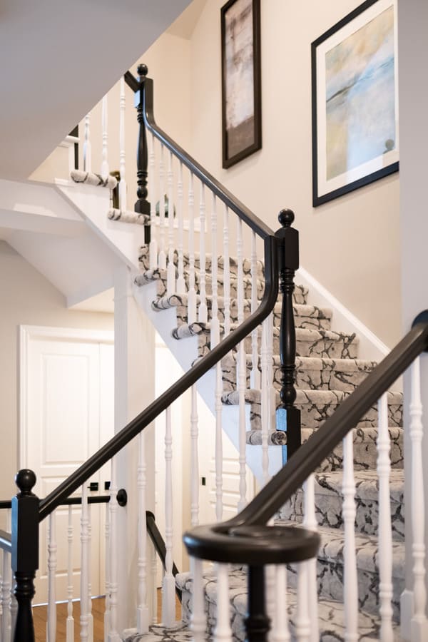 NOTL home renovation stairs with custom black and white carpet